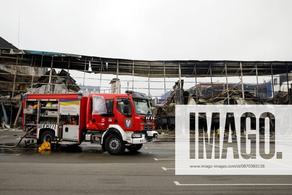 A fire engine is involved in a response effort to a Russian ballistic missile attack on an Epicentr K home improvement hypermarket and the surrounding shopping area in the Obolonskyi district, Kyiv, Ukraine, October 22, 2026. On Thursday night, Russian forces struck the Ukrainian capital with ballistic missiles and drones. According to the Kyiv City Military Administration, six districts came under attack. One person was killed, 24 were injured, and 16 of them were hospitalised. (Photo by Marianna Kotyk Ukrinform) Russian attack destroys shops in Kyiv