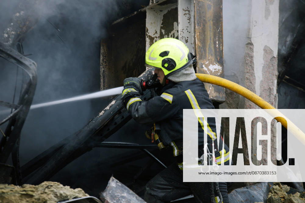 A State Emergency Service rescuer extinguishes a fire during a response effort to a Russian ballistic missile attack on an Epicentr K home improvement hypermarket and the surrounding shopping area in the Obolonskyi district, Kyiv, Ukraine, October 22, 2026. On Thursday night, Russian forces struck the Ukrainian capital with ballistic missiles and drones. According to the Kyiv City Military Administration, six districts came under attack. One person was killed, 24 were injured, and 16 of them were hospitalised. (Photo by Marianna Kotyk Ukrinform) Russian attack destroys shops in Kyiv