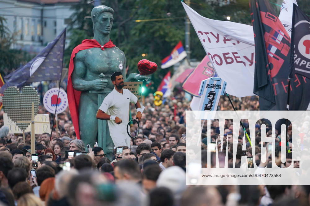 20261022, Belgrade, Serbia - Supporters and members of the student protest movement ( Student List - Students Are Winning ) gather at Slavija Square for a massive final pre-election rally ahead of the upcoming parliamentary elections. Walkers and student columns from multiple cities across Serbia converged on the capital after days of marching, rallying under the slogan Victory Calls to mobilize voters before the electoral silence begins.Protesters carry a replica of the Pobednik (The Victor) monument, the symbol of Belgrade, along with a cardboard cutout of tennis player Novak Djokovic, who supports the students, and a sign shaped like a Diego Maradona jersey with the number 3, - ZUMAd223 20261022_zip_d223_016