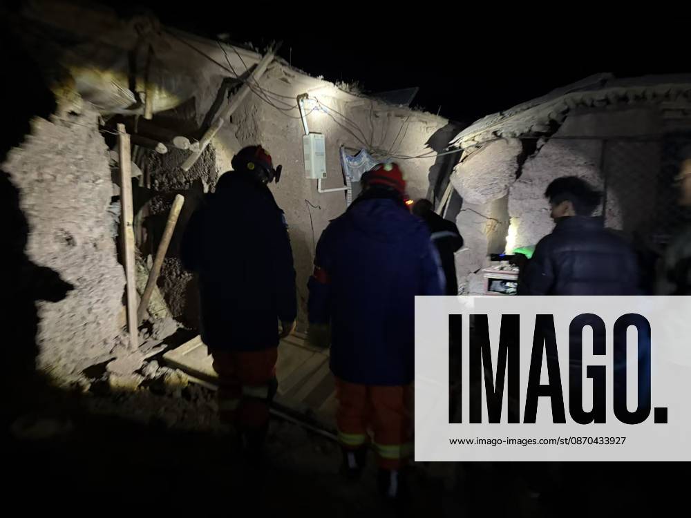 (261023) -- NAGQU, Oct. 23, 2026 -- Firefighters inspect an earthquake-hit village in Baqen County of Nagqu City in southwest China s Xizang Autonomous Region, on Oct. 23, 2026. Sixteen people were killed and 32 others injured after a 7.0-magnitude earthquake struck Baqen County of Nagqu City in southwest China s Xizang Autonomous Region at 10:33 p.m. Thursday (Beijing Time), according to the city s emergency management bureau. As of 2:25 a.m. Friday, 11 of the injured were in serious condition while 21 sustained minor injuries. Over 300 houses collapsed. The damage caused by the quake is being further evaluated, and disaster relief work is underway. More than 300 police officers have been dispatched to the epicenter for relief wor