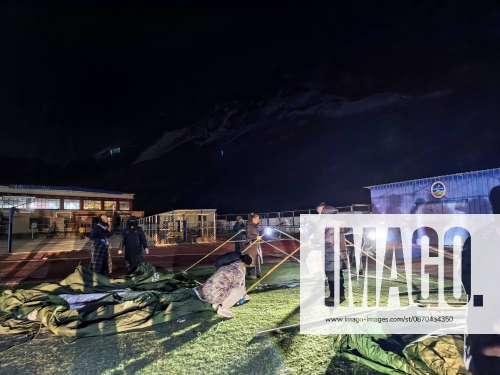 (261023) -- NAGQU, Oct. 23, 2026 -- Tents are being set up for quake-affected residents at a primary school in Baqen County of Nagqu City, southwest China s Xizang Autonomous Region, Oct. 23, 2026. Sixteen people were killed and 32 others injured after a 7.0-magnitude earthquake struck Baqen County of Nagqu City in southwest China s Xizang Autonomous Region at 10:33 p.m. Thursday (Beijing Time), according to the city s emergency management bureau. The damage caused by the quake is being further evaluated, and disaster relief work is underway. Xizang has activated a Level-II earthquake disaster emergency response, according to the regional emergency command center. (SpotNews) CHINA-XIZANG-NAGQU-EARTHQUAKE-DISASTER EMERGENCY RESPONSE