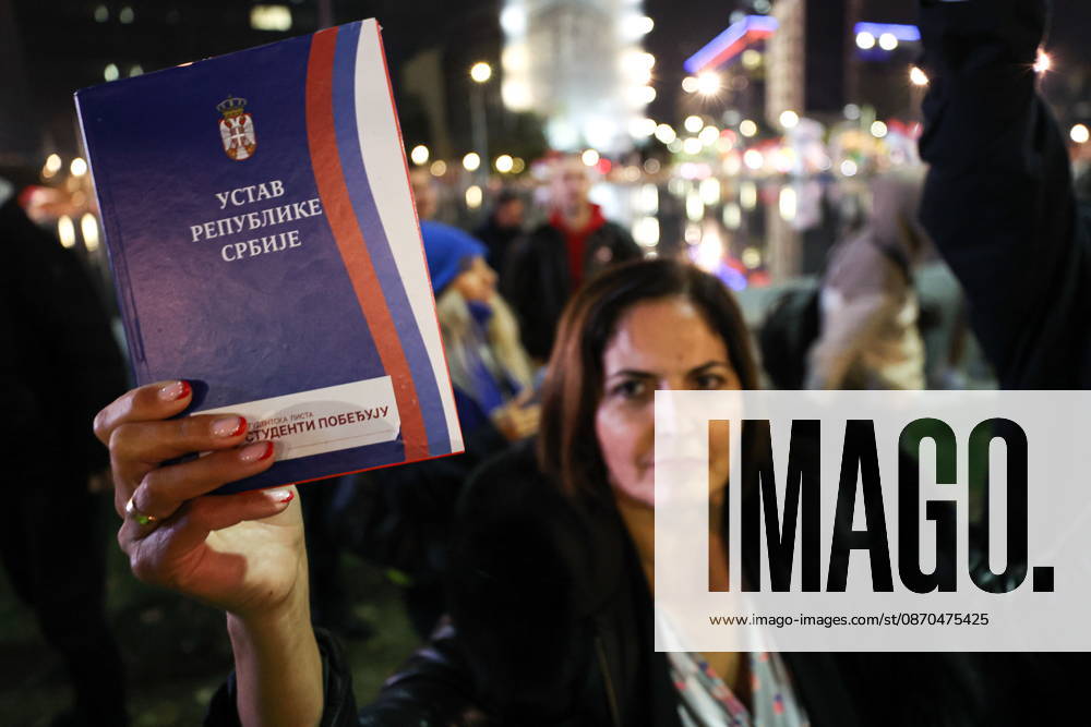 SERBIA, BELGRADE - OCTOBER 22, 2026: A woman appears with a copy of the Constitution of Serbia during a rally held by the Student List movement ahead of the 2026 Serbian parliamentary election scheduled for October 25. Alexander Ryumin TASS 99800936