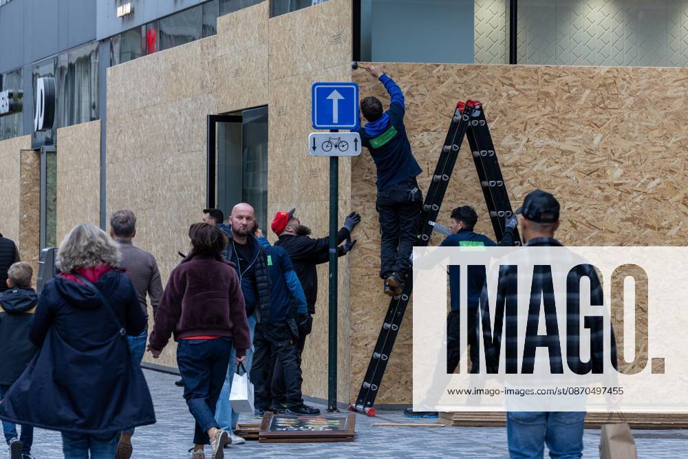Storefronts boarded up with wooden panels at Rue Neuve Nieuwstraat, in Brussels, on Friday 23 October 2026. Stores are preparing for another protest scheduled for Saturday. NICOLASxMAETERLINCK 190739878