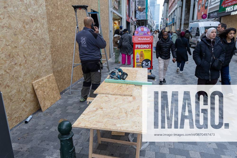 Storefronts boarded up with wooden panels at Rue Neuve Nieuwstraat, in Brussels, on Friday 23 October 2026. Stores are preparing for another protest scheduled for Saturday. NICOLASxMAETERLINCK 190739543