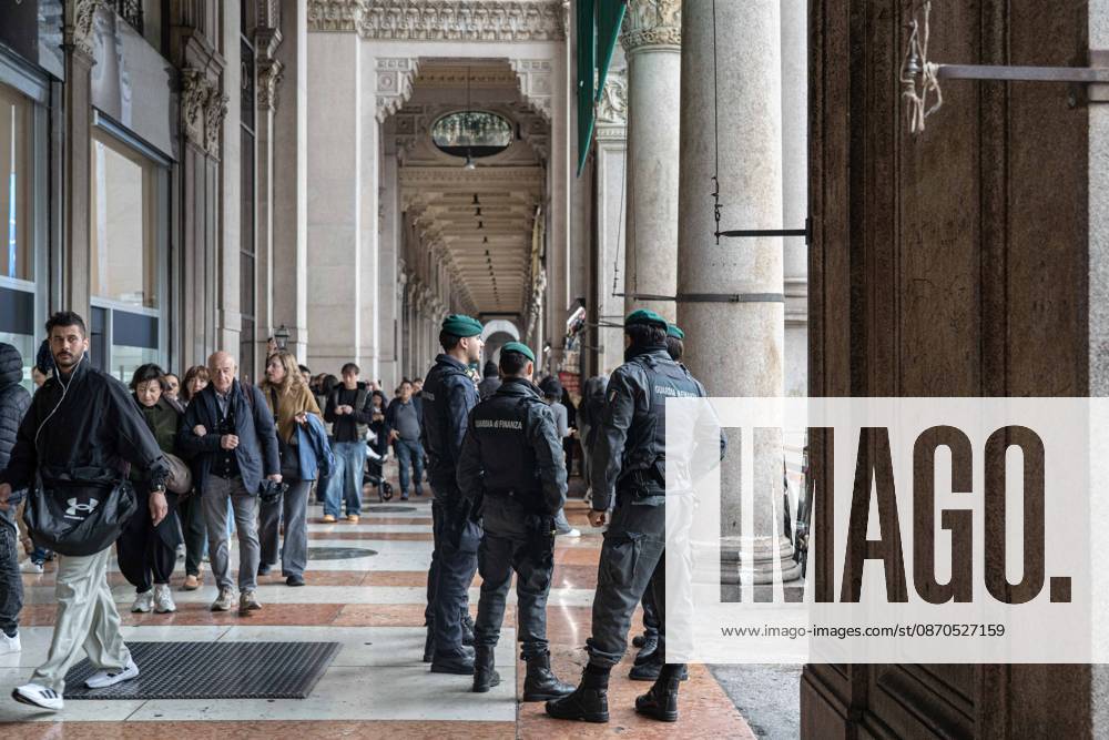 IPA90074200 - Milan, October 23, 2026. The city center is preparing for tomorrows heavily secured Saturday ahead of the march. From police and Carabinieri checkpoints at the Duomo to storefronts reinforced with panels to prevent break-ins on Via Torino.