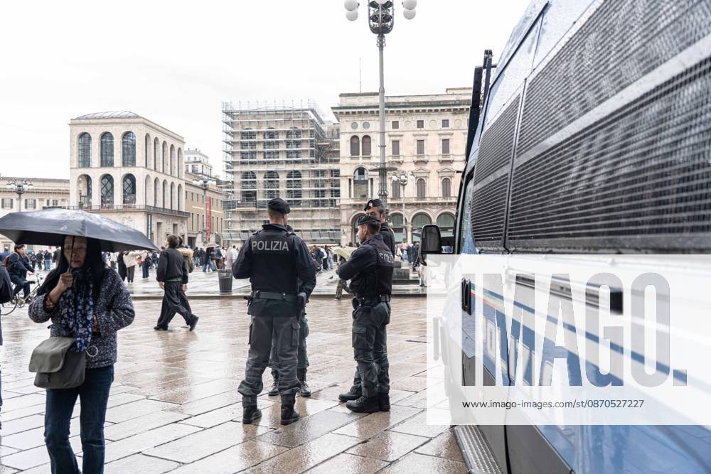 IPA90074208 - Milan, October 23, 2026. The city center is preparing for tomorrows heavily secured Saturday ahead of the march. From police and Carabinieri checkpoints at the Duomo to storefronts reinforced with panels to prevent break-ins on Via Torino.