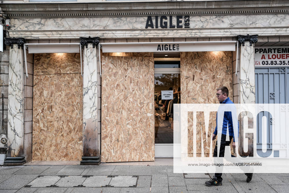 Shopfronts boarded up in Nancy ahead of planned protests NANCY, FRANCE - OCTOBER 23: Workers install protective wooden boards and plywood panels over shopfronts and commercial venues across downtown Nancy, France, on October 23, 2026. Local business owners and municipal authorities reinforced physical security measures ahead of large-scale public demonstrations planned for October 24, seeking to prevent vandalism and structural damage along major commercial corridors. Muhammed Said Tako Anadolu Nancy France. Editorial use only. Please get in touch for any other usage.