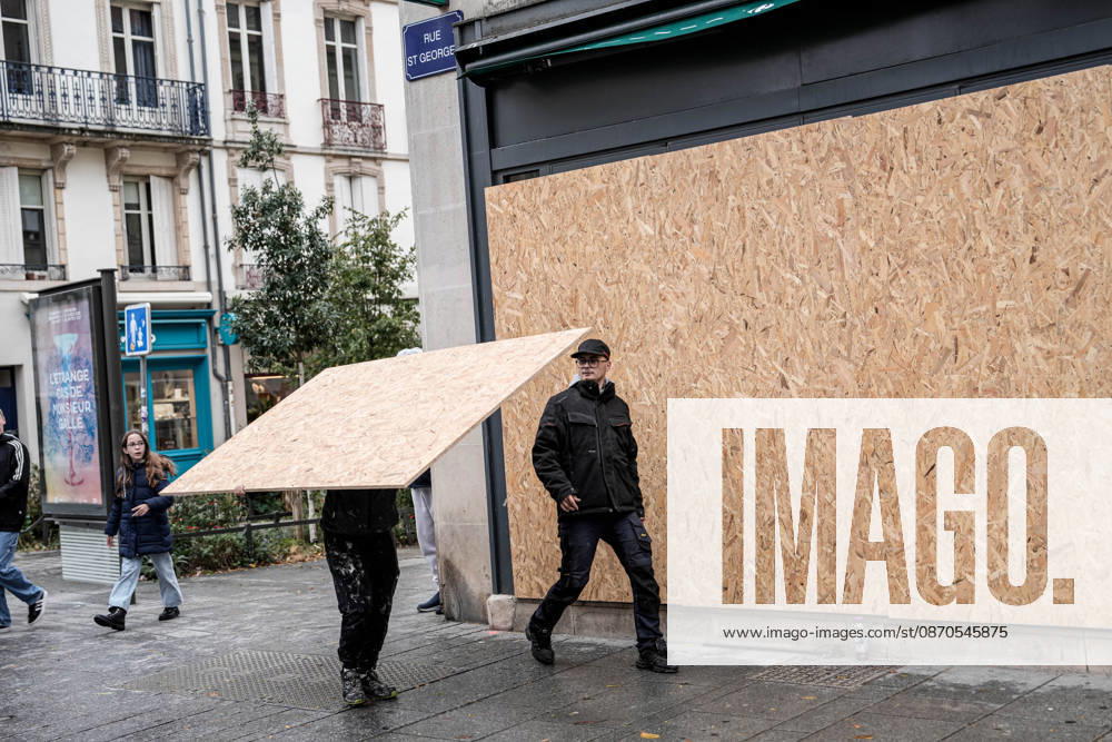 Shopfronts boarded up in Nancy ahead of planned protests NANCY, FRANCE - OCTOBER 23: Workers install protective wooden boards and plywood panels over shopfronts and commercial venues across downtown Nancy, France, on October 23, 2026. Local business owners and municipal authorities reinforced physical security measures ahead of large-scale public demonstrations planned for October 24, seeking to prevent vandalism and structural damage along major commercial corridors. Muhammed Said Tako Anadolu Nancy France. Editorial use only. Please get in touch for any other usage.