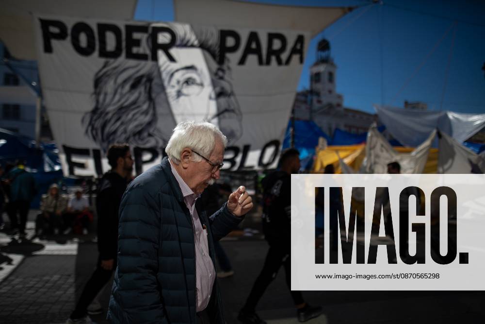 A man walks in front of tents set up at Puerta del Sol..Tents remain set up by housing rights activists, who organized the occupation of the square in response to the eviction of Maricarmenâ€a woman in her eightiesâ€from her home, carried out by a real estate investment fund. Madrid Spain - ZUMAs197 20261023_aaa_s197_147