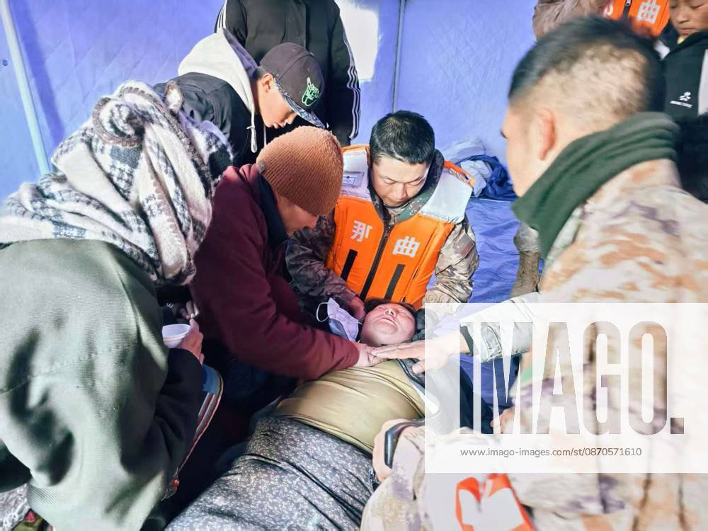 (261024) -- NAGQU, Oct. 24, 2026 -- Members of the People s Armed Police Force Xizang Corps provide medical treatment to a villager at a quake-hit village in Maru Township of Baqen County, Nagqu City, southwest China s Xizang Autonomous Region, Oct. 23, 2026. Sixteen people have been killed and 76 others are injured following a 7.0-magnitude earthquake that struck Baqen County of the city of Nagqu in southwest China s Xizang Autonomous Region at 10:33 p.m. on Thursday, local authorities said. (Photo by Xinhua) (SpotNews) CHINA-XIZANG-NAGQU-EARTHQUAKE-RESCUE (CN) WangxJianing