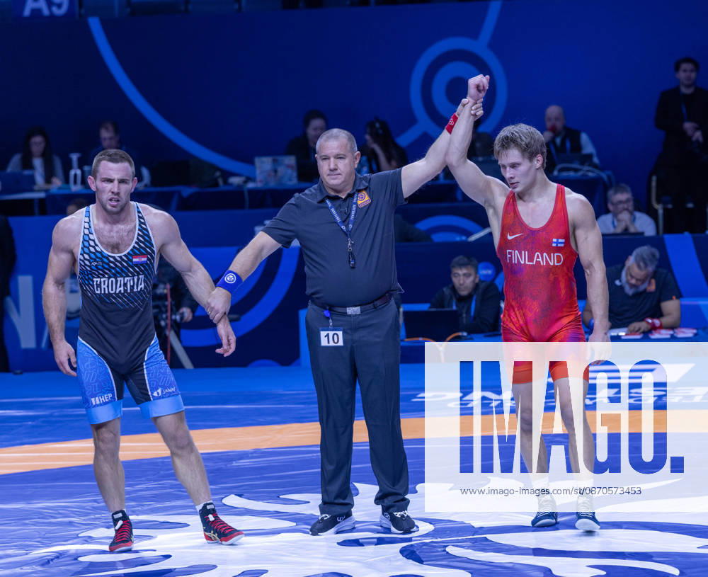 Astana, 2021 World Wrestling Championshi, Kazakhstan: Finland s Jonni Kunnari Sarkkinen (red) competes against Croatia s Antonio Kamenjasevic (blue) in the men s Greco-Roman 77kg competition at the Senior World Wrestling Championships in Astana, Kazakhstan, on October 24, 2026. Sarkkinen won the bout 7-2. . Astana Kazakhstan - ZUMAt172 20261024_zip_t172_006