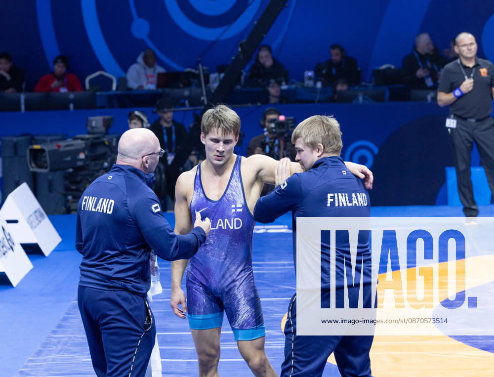 Astana, 2021 World Wrestling Championshi, Kazakhstan: Finland s Jonni Kunnari Sarkkinen listens to instructions from his coaches during his second bout in the men s Greco-Roman 77kg competition at the Senior World Wrestling Championships in Astana, Kazakhstan, on October 24, 2026. Sarkkinen lost the bout. . Astana Kazakhstan - ZUMAt172 20261024_zip_t172_009