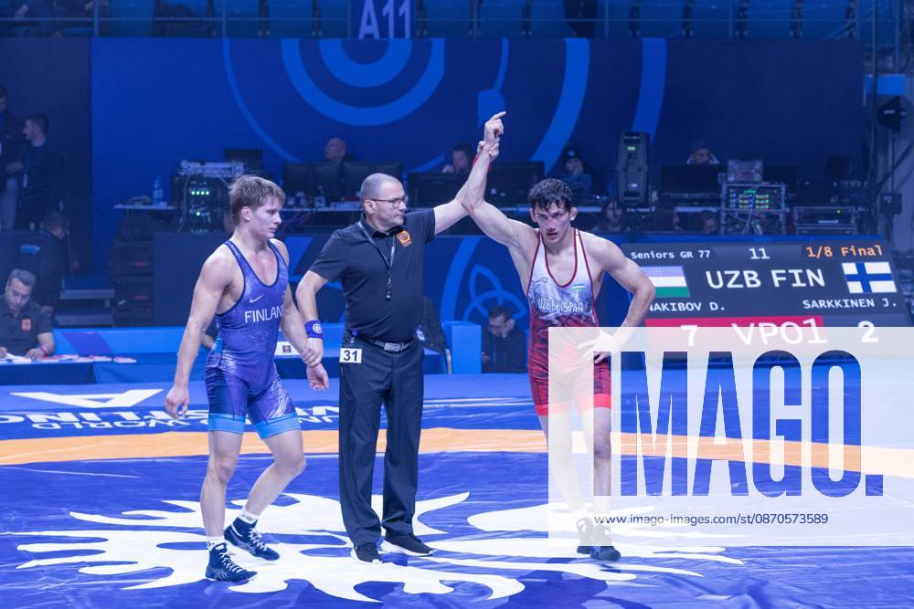Astana, 2021 World Wrestling Championshi, Kazakhstan: Uzbekistan s Doniyorkhon Nakibov celebrates his victory as the referee raises his hand after defeating Finland s Jonni Kunnari Sarkkinen 7-2 in the men s Greco-Roman 77kg competition at the Senior World Wrestling Championships in Astana, Kazakhstan, on October 24, 2026. . Astana Kazakhstan - ZUMAt172 20261024_zip_t172_010