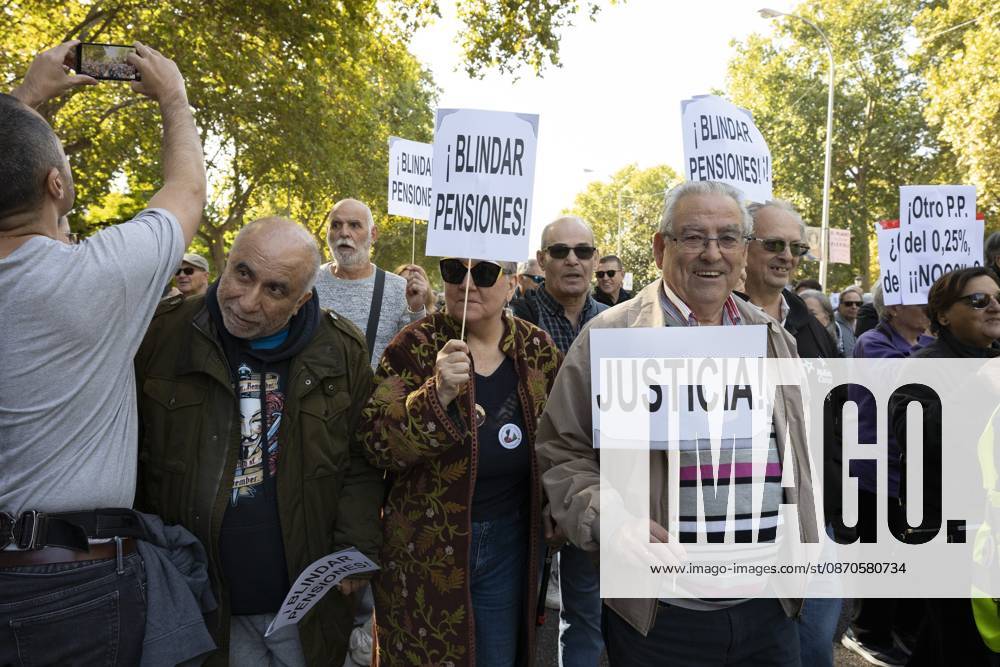 Several people carrying signs in favor of public pensions take part in a demonstration supporting the public pension system and access to housing in Madrid, Spain. Madrid Spain - ZUMAs197 20261024_aaa_s197_054