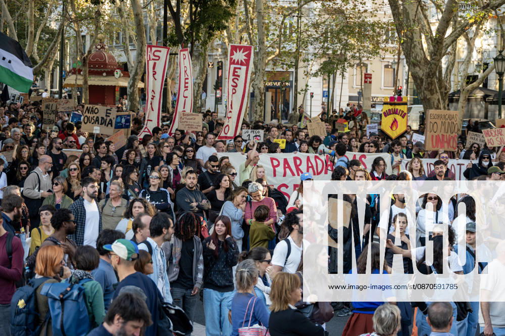 Demonstrators take part in a protest organized by the Acampada de Lisboa housing movement, demanding affordable housing, limits on rising rents and an end to property speculation. The march takes place in central Lisbon, from Marques de Pombal to Rossio Square, following recent police removal of protest tents and the detention of 55 demonstrators during housing protests in the Portuguese capital. Lisbon Portugal - ZUMAr238 20261024_zip_r238_064
