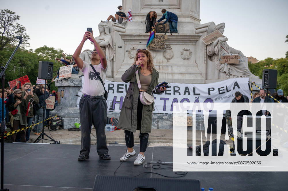 Demonstrators take part in a protest organized by the Acampada de Lisboa housing movement, demanding affordable housing, limits on rising rents and an end to property speculation. The march takes place in central Lisbon, from Marques de Pombal to Rossio Square, following recent police removal of protest tents and the detention of 55 demonstrators during housing protests in the Portuguese capital. Lisbon Portugal - ZUMAr238 20261024_zip_r238_083