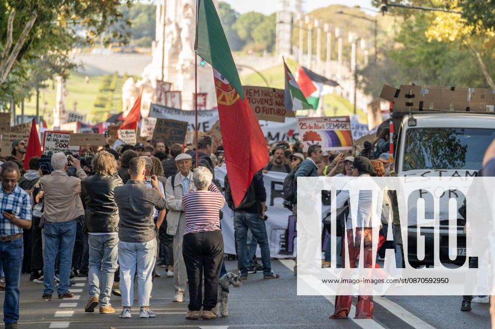 Demonstrators take part in a protest organized by the Acampada de Lisboa housing movement, demanding affordable housing, limits on rising rents and an end to property speculation. The march takes place in central Lisbon, from Marques de Pombal to Rossio Square, following recent police removal of protest tents and the detention of 55 demonstrators during housing protests in the Portuguese capital. Lisbon Portugal - ZUMAr238 20261024_zip_r238_019