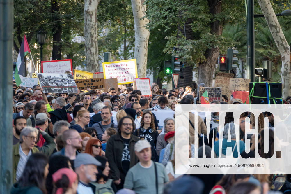 Demonstrators take part in a protest organized by the Acampada de Lisboa housing movement, demanding affordable housing, limits on rising rents and an end to property speculation. The march takes place in central Lisbon, from Marques de Pombal to Rossio Square, following recent police removal of protest tents and the detention of 55 demonstrators during housing protests in the Portuguese capital. Lisbon Portugal - ZUMAr238 20261024_zip_r238_022