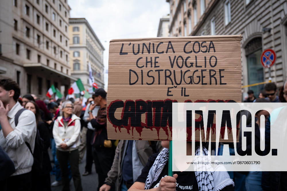 Thousands of people take to the streets to join the Get Italy out of the war march. Participants are calling for peace and protesting against the rising cost of living. The only thing I want to destroy is capitalism reads the sign. Rome Italy - ZUMAg256 20261024_znp_g256_005