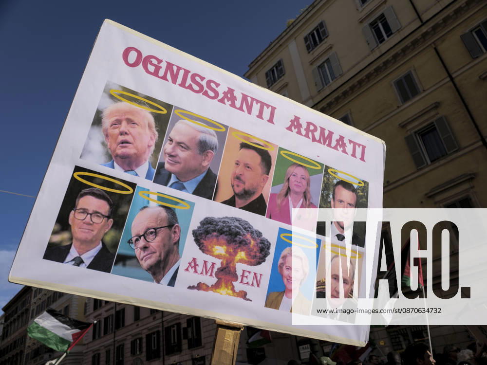 Rome Anti War Protest A demonstrator holds a placard featuring public figures during an anti-war protest in Rome, Italy on October 24, 2026. Demonstrators took part in an anti-war march under the slogan Keep Italy Out of the War . Protesters further voiced opposition to Italy s involvement in armed conflicts, military rearmament and government policies. Rome Lazio Italy