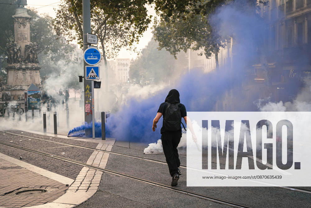 Marseille France Street Protests A demonstrators walk near smoke during a protest in Marseille, France on October 24, 2026. Authorities deployed around 70,000 security personnel across France for renewed protests over the cost of living, after unrest a week earlier saw public buildings damaged, hundreds of shops looted and about 2,700 people arrested. Marseille Provence-Alpes-CÃ te France