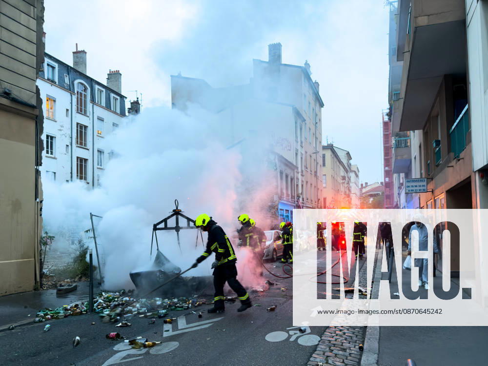 Lyon France Protests October 24 Firefighters extinguish a fire during a protest in Lyon, France on October 24, 2026. Authorities deployed around 70,000 security personnel across France for renewed protests over the cost of living, after unrest a week earlier saw public buildings damaged, hundreds of shops looted and about 2,700 people arrested. Lyon Rhone Alpes France