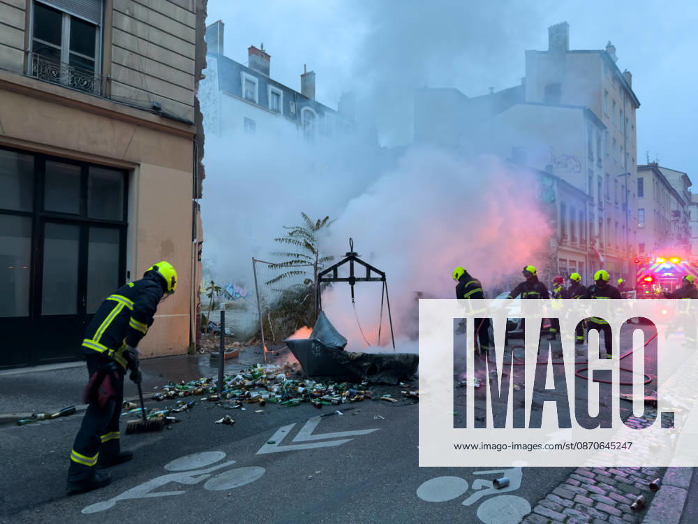 Lyon France Protests October 24 Firefighters extinguish a fire during a protest in Lyon, France on October 24, 2026. Authorities deployed around 70,000 security personnel across France for renewed protests over the cost of living, after unrest a week earlier saw public buildings damaged, hundreds of shops looted and about 2,700 people arrested. Lyon Rhone Alpes France