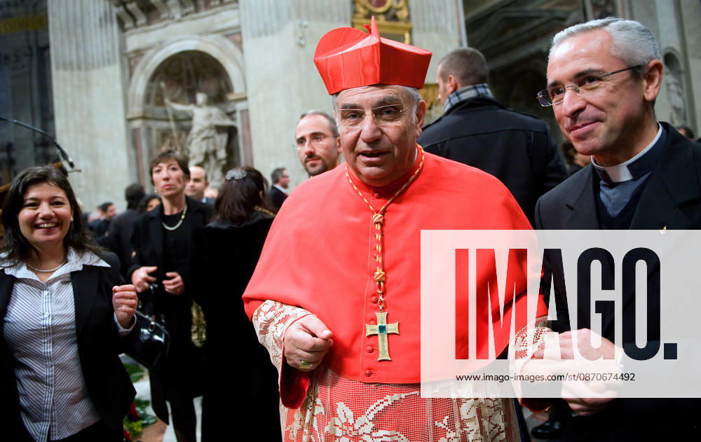 IPA90156508 - New Cardinal Paolo Romeo of Palermo, Italy (L) is congratulated by pilgrims after receiving the red biretta—a four-cornered red hat—from Pope Benedict XVI during the consistory ceremony in St. Peter s Basilica at the Vatican on November 20, 2010