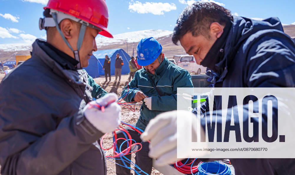 (261025) -- BAQEN, Oct. 25, 2026 -- Power supply staff sort electrical wires at a resettlement site of a quake-hit village in Maru Township of Baqen County, Nagqu City, southwest China s Xizang Autonomous Region, Oct. 25, 2026. Power supply lines are being installed for prefabricated houses in the quake-hit Baqen County. According to the State Grid, power connection supplies for 2,724 tents and 2,400 prefabricated houses have been deployed to meet electricity connection needs in the quake-hit area. ) CHINA-XIZANG-EARTHQUAKE-POWER SUPPLY LINES (CN) TenzinxNyida