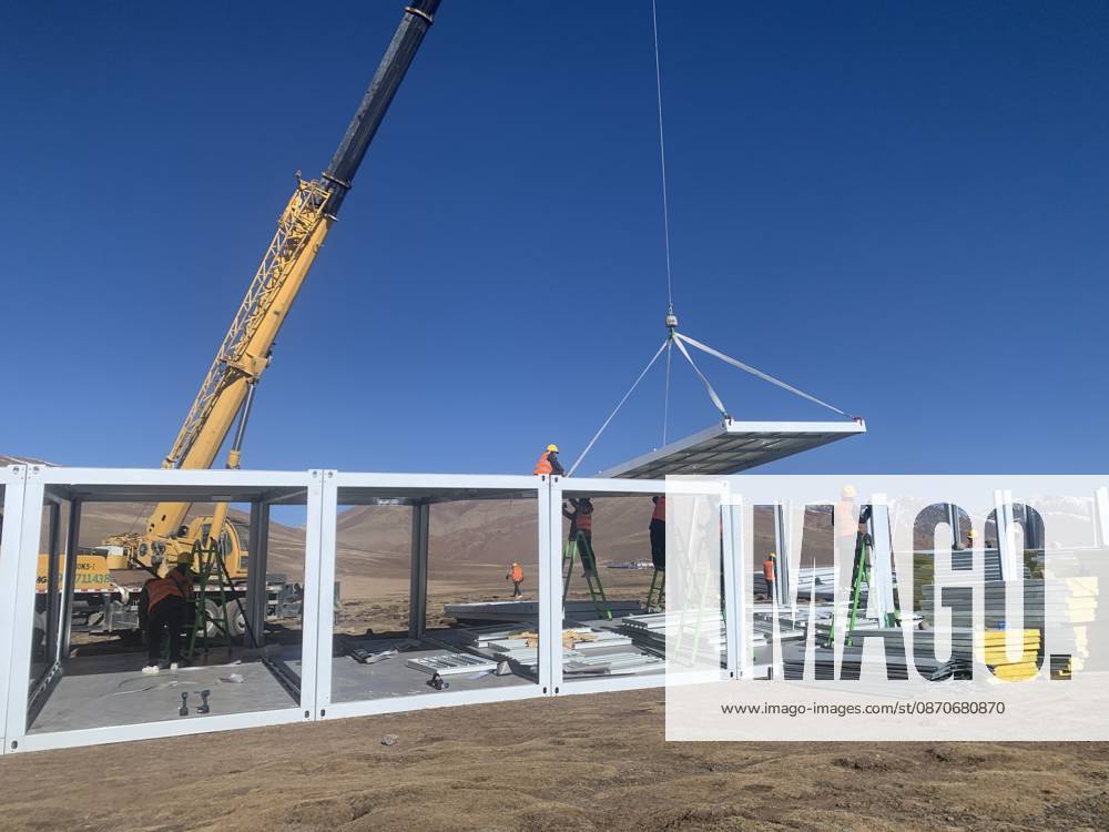 (261025) -- BAQEN, Oct. 25, 2026 () -- Rescuers from the China Railway 20th Bureau Group Corporation Limited build prefabricated houses at a quake-hit village in Gangchen Township of Baqen County, Nagqu City, southwest China s Xizang Autonomous Region, Oct. 25, 2026. Rescue and relief efforts continue after a 7.0-magnitude earthquake struck Baqen County of the city of Nagqu in southwest China s Xizang Autonomous Region, local authorities said Saturday. The roof panels of the first batch of prefabricated houses have been installed in Sunday afternoon in the quake-hit village in Gangchen Township of Baqen, and the laying of cables and the installation of doors and windows have been advanced successively. Currently, seven prefabricated houses