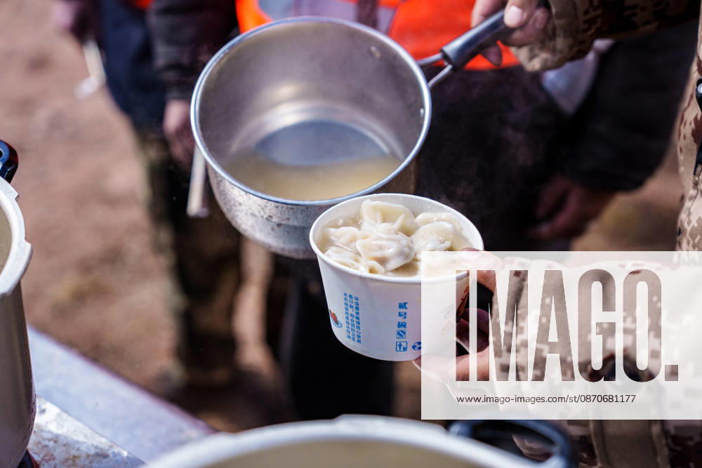 (261025) -- BAQEN, Oct. 25, 2026 -- Du Guoping distributes dumplings to rescuers at a temporary shelter in Maru Township of Baqen County, Nagqu City, southwest China s Xizang Autonomous Region, Oct. 24, 2026. After a 7.0-magnitude earthquake struck Baqen County in Nagqu, southwest China s Xizang Autonomous Region, on Thursday, Du Guoping, owner of a dumpling restaurant in Xigaze, postponed the opening of his two new restaurants and headed to the disaster zone with his staff. It took only about 10 minutes to make the decision that we would go to Baqen and cook dumplings for earthquake-affected residents, Du said. The team loaded more than 1,500 kilograms of dumplings onto vehicles and set off from Xigaze at midnight on the night of th