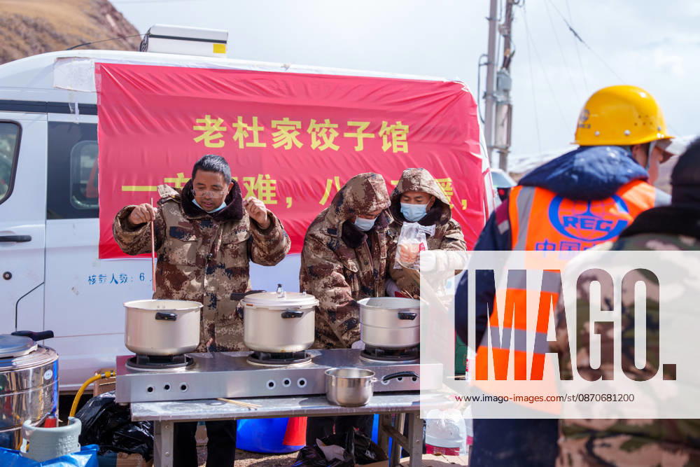(261025) -- BAQEN, Oct. 25, 2026 -- Du Guoping (L) cooks dumplings at a temporary shelter in Maru Township of Baqen County, Nagqu City, southwest China s Xizang Autonomous Region, Oct. 24, 2026. After a 7.0-magnitude earthquake struck Baqen County in Nagqu, southwest China s Xizang Autonomous Region, on Thursday, Du Guoping, owner of a dumpling restaurant in Xigaze, postponed the opening of his two new restaurants and headed to the disaster zone with his staff. It took only about 10 minutes to make the decision that we would go to Baqen and cook dumplings for earthquake-affected residents, Du said. The team loaded more than 1,500 kilograms of dumplings onto vehicles and set off from Xigaze at midnight on the night of the earthquake.