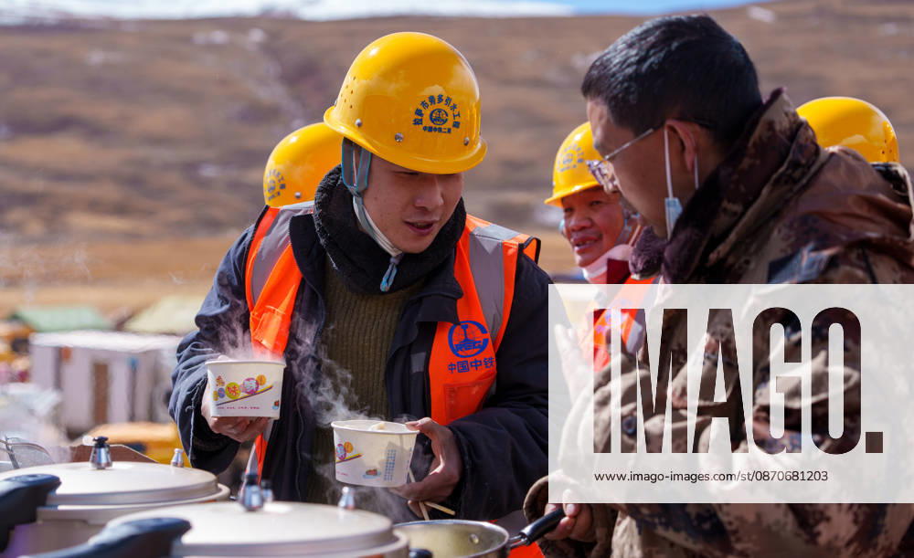 (261025) -- BAQEN, Oct. 25, 2026 -- A rescuer thanks Du Guoping (R) at a temporary shelter in Maru Township of Baqen County, Nagqu City, southwest China s Xizang Autonomous Region, Oct. 24, 2026. After a 7.0-magnitude earthquake struck Baqen County in Nagqu, southwest China s Xizang Autonomous Region, on Thursday, Du Guoping, owner of a dumpling restaurant in Xigaze, postponed the opening of his two new restaurants and headed to the disaster zone with his staff. It took only about 10 minutes to make the decision that we would go to Baqen and cook dumplings for earthquake-affected residents, Du said. The team loaded more than 1,500 kilograms of dumplings onto vehicles and set off from Xigaze at midnight on the night of the earthquake.