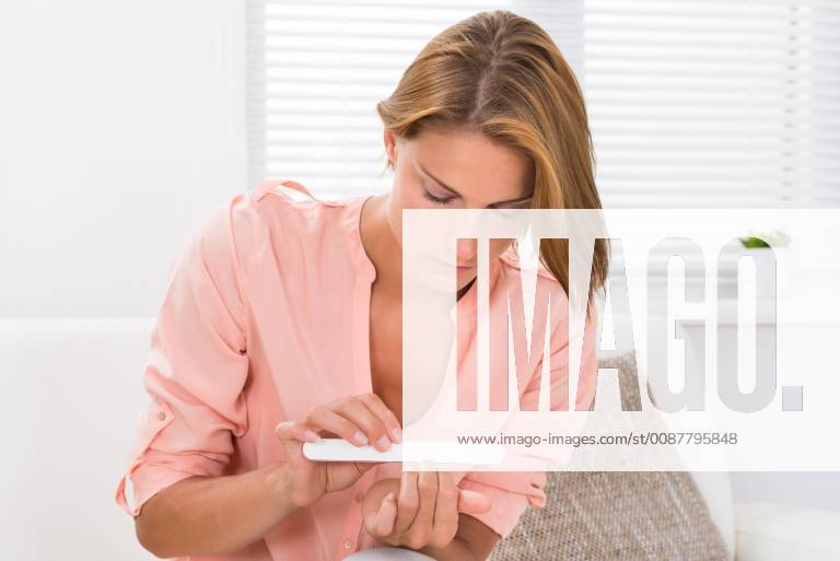 Woman Filing Nails With File model released Symbolfoto