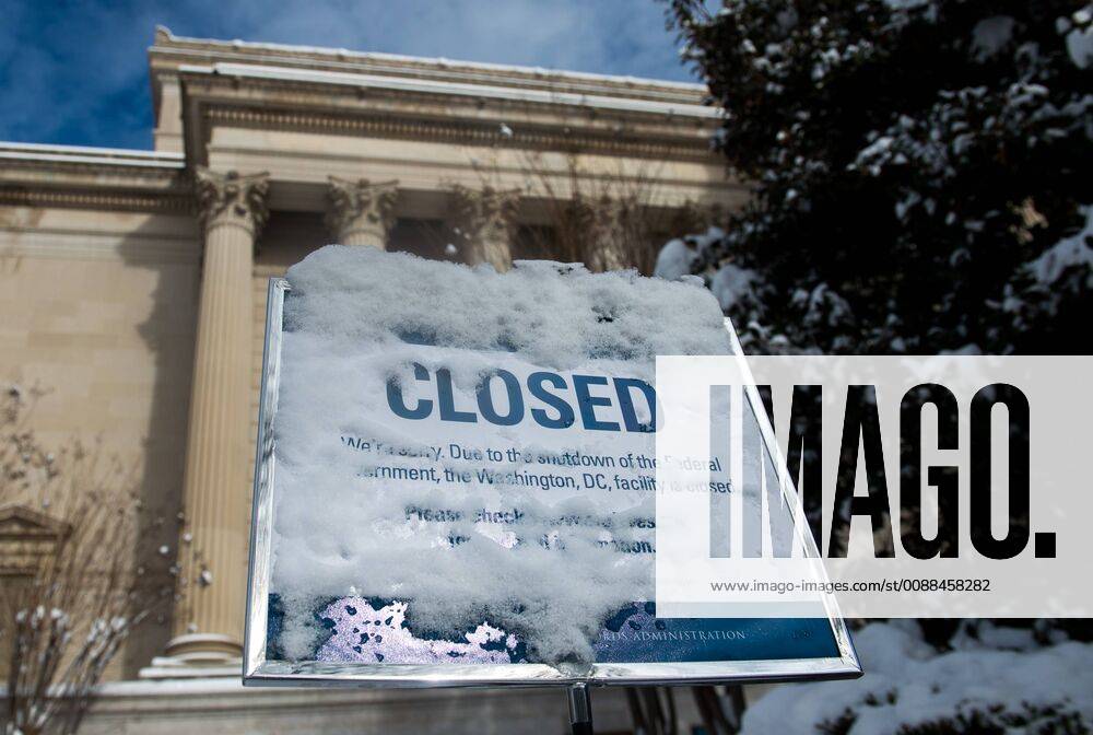 A snow covered closed sign is seen at the National Archives as the partial federal government shutdown enters its 24th day, in Washington, D.C. region, January 14, 2019. Congress and the White House can not reach a deal on a spending bill as President Trump s request for $5.7 billion for a southern border wall. WAP20190114328 KEVINxDIETSCH