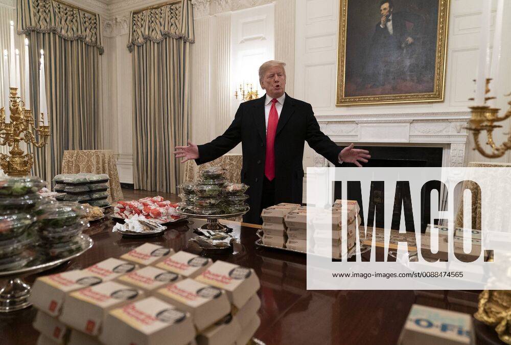 United States President Donald J. Trump presents fast food burgers and pizza that is to be served to the Clemson Tigers to celebrate their NCAA Football Championship at the White House on January 14, 2019. The fast-food was apparently necessary due to the recent snow and the partial government shutdown. WAX20190114106 ChrisxKleponis