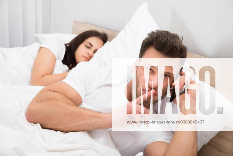 Man Talking Privately On Cellphone model released Symbolfoto