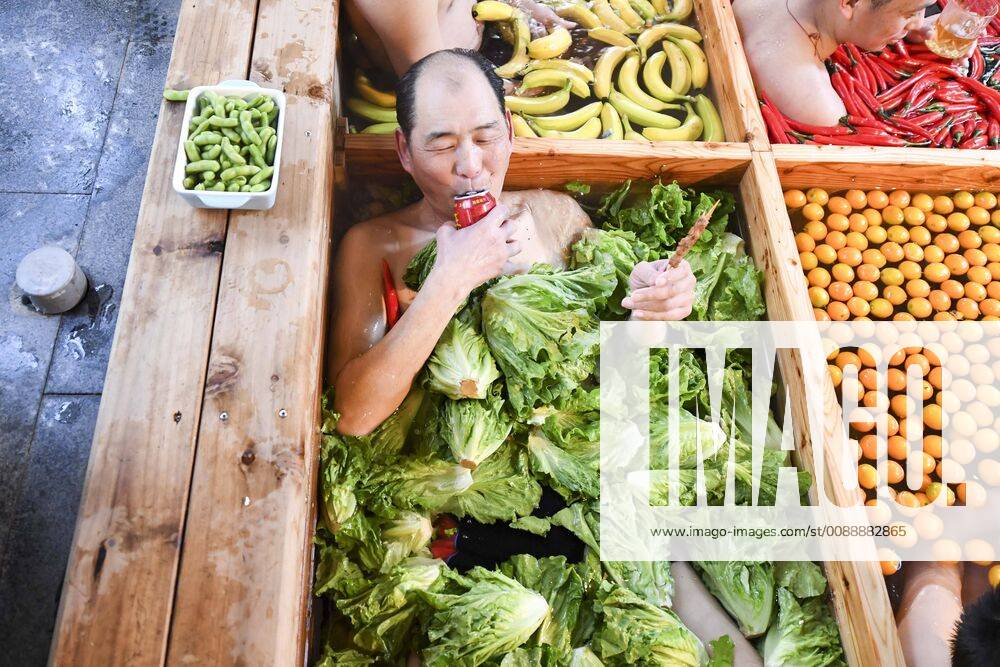 A man born in the Year of the Pig drinks beverage in a hot pot shaped hot spring at a hotel to welcome the Chinese New Yeaar on January 27, 2019 in Hangzhou, Zhejiang Province of China. The hot pot shaped hot spring in Hangzhou has vegetables and fruits, including lettuce, chilis, tomatoes, apples, bananas, mushrooms and corns. The Chinese New Year falls on February 5 this year.