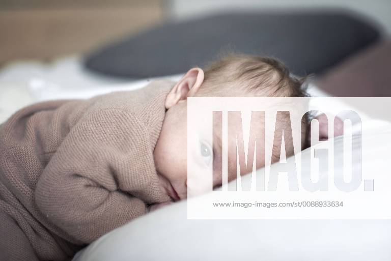 Newborn baby lying down, portrait