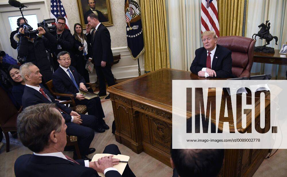 President Donald Trump (R) makes remarks during a meeting with a Chinese trade delegation headed by Vice Premier Liu He (L) as US Trade Representative Robert Lighthizer (L, foreground) attends, at the White House, Washington, DC, January 31, 2019. Trump has set a deadline of March 1 for resolution of various trade issues before tariffs are imposed on Chinese imports to America. WAP20190131512 MIKExTHEILER