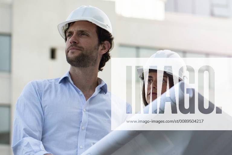 Architects reviewing blueprint