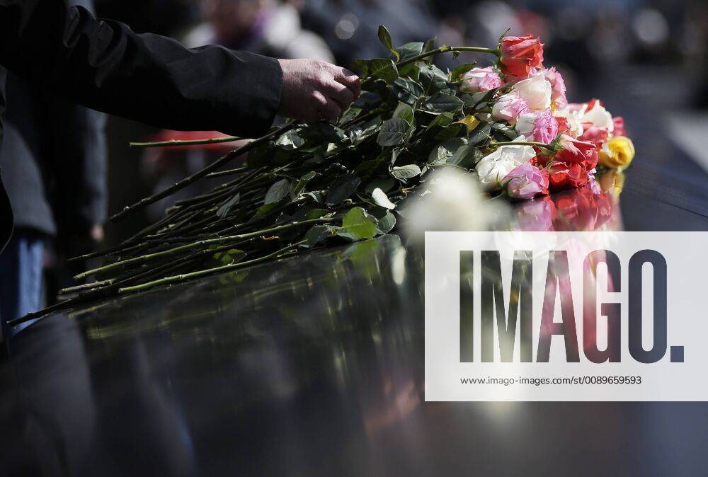 Mourners react when they lay flowers at the Reflecting Pools at the annual remembrance ceremony at the National September 11 Memorial & Museum to commemorate the 26th anniversary of the 1993 World Trade Center bombing that killed six and injured over 1,000 on February 26, 2019 in New York City. As part of the ceremony, family members of the victims read aloud their names and place roses at their names on the Memorial. NYP20190226127 JOHNxANGELILLO