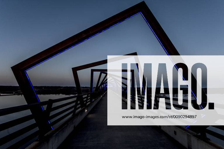 Madrid, Iowa, U.S. - Originally a conduit for rail freight, but now a decomissioned railroad line, the High Trestle Trail Bridge is part of the 25-mile Trestle Trail path for bikers, hikers and horseback riders. The artistic, spiral steel frames springing up from the road bed are a nod to the shape of the timbers placed in former central Iowa coal mines. Madrid U.S. - ZUMAce6_ 20190322_zaf_ce6_020