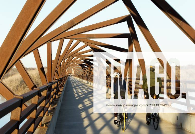Madrid, Iowa, U.S. - Originally a conduit for rail freight, but now a decomissioned railroad line, the High Trestle Trail Bridge is part of the 25-mile Trestle Trail path for bikers, hikers and horseback riders. The artistic, spiral steel frames springing up from the road bed are a nod to the shape of the timbers placed in former central Iowa coal mines. Madrid U.S. - ZUMAce6_ 20190322_zaf_ce6_014