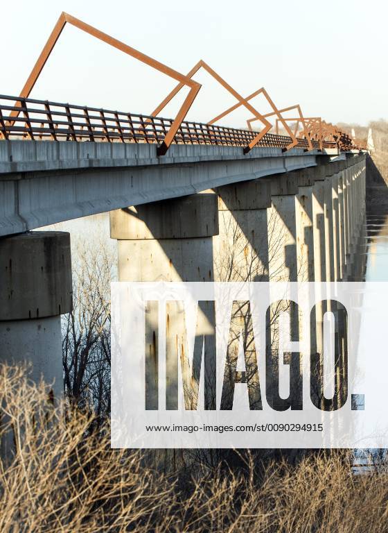 Madrid, Iowa, U.S. - Originally a conduit for rail freight, but now a decomissioned railroad line, the High Trestle Trail Bridge is part of the 25-mile Trestle Trail path for bikers, hikers and horseback riders. The artistic, spiral steel frames springing up from the road bed are a nod to the shape of the timbers placed in former central Iowa coal mines. Madrid U.S. - ZUMAce6_ 20190322_zaf_ce6_005