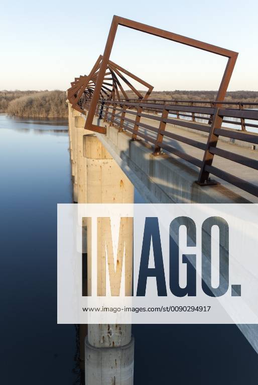 Madrid, Iowa, U.S. - Originally a conduit for rail freight, but now a decomissioned railroad line, the High Trestle Trail Bridge is part of the 25-mile Trestle Trail path for bikers, hikers and horseback riders. The artistic, spiral steel frames springing up from the road bed are a nod to the shape of the timbers placed in former central Iowa coal mines. Madrid U.S. - ZUMAce6_ 20190322_zaf_ce6_007