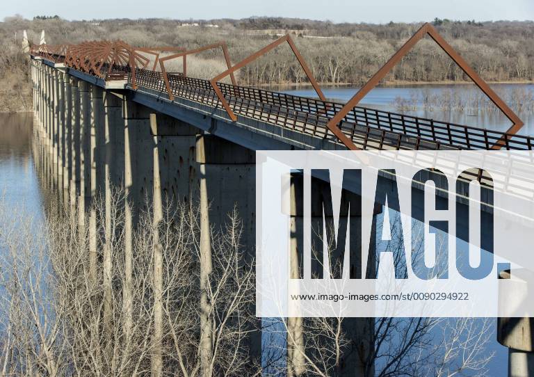 Madrid, Iowa, U.S. - Originally a conduit for rail freight, but now a decomissioned railroad line, the High Trestle Trail Bridge is part of the 25-mile Trestle Trail path for bikers, hikers and horseback riders. The artistic, spiral steel frames springing up from the road bed are a nod to the shape of the timbers placed in former central Iowa coal mines. Madrid U.S. - ZUMAce6_ 20190322_zaf_ce6_004