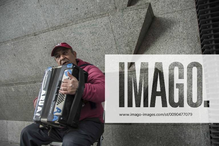 Madrid, Madrid, Spain - A man see playing the accordion at the callao square in Madrid..The City Council will begin to confiscate and sanction this April the amplifiers from the street musicians who do not have authorization, the government is launching a series of measures aimed at caring for public space that will last until after the summer. Fuencarral Street and the squares of Santa Ana, Plaza del Angel, Plaza Mayor and Plaza Dos de Mayo have been excluded from the authorized areas or for tertiary use due to the inconvenience generated to the neighbours as they have become points of non-compliance. The City Council has initiated 21 sanctioning procedures for the most serious infractions, such as non-compliance with the schedule, excessive amplification or touching in unauthorized places. Madrid Spain - ZUMAs197 20190403_zab_s197_075