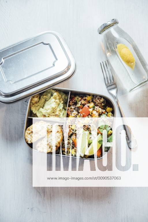 Bento box of quinoa salad with vegetables and lime, avocado cream and cauliflower dumplings IPF00495