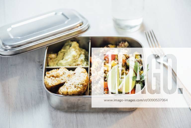 Bento box of quinoa salad with vegetables and lime, avocado cream and cauliflower dumplings IPF00496